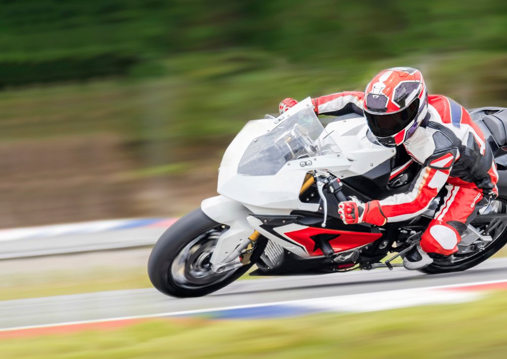 Racer Riding a Motorcycle in a Racing Competition